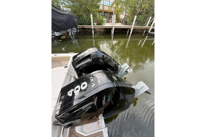 Slide: The Image of Twin 400 horsepower outboard engines on a 2004 Grady-White Canyon 306 boat. - 18