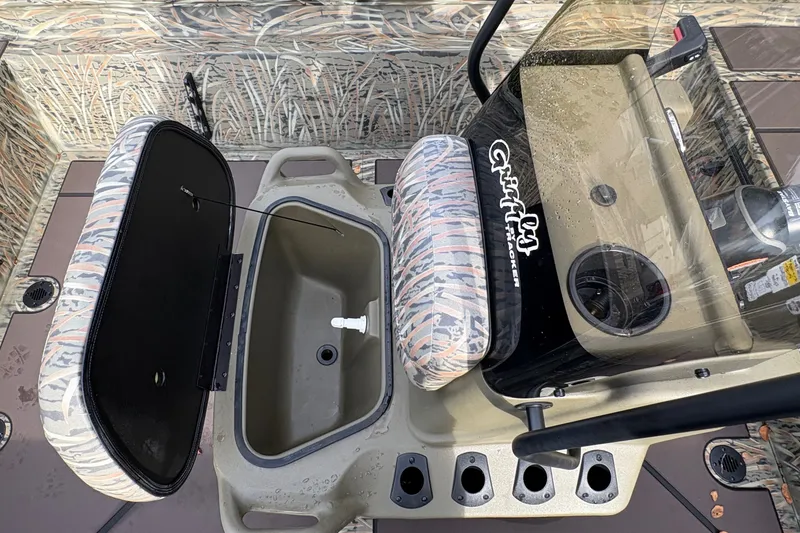 Slide: The Image of Interior view of 2027 Tracker Grizzly 1860 CC boat with storage compartments and console. - 14