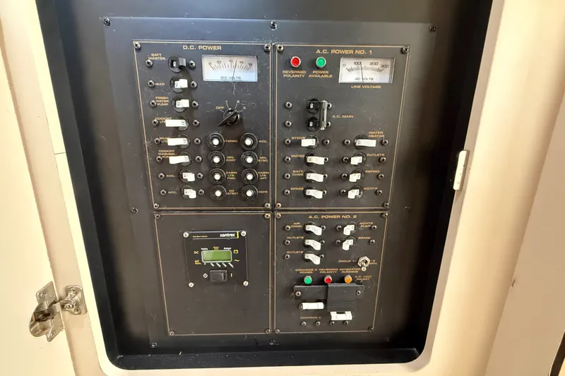 Slide: The Image of Electrical control panel on a 1999 Cruisers Yachts 3075 Rogue boat. - 53