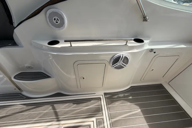 Slide: The Image of 1999 Cruisers Yachts 3075 Rogue interior with speakers and storage compartments. - 13