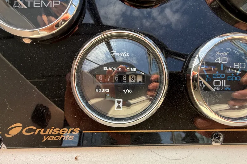 Slide: The Image of 1999 Cruisers Yachts 3075 Rogue dashboard with elapsed time gauge reading 768.9 hours. - 24