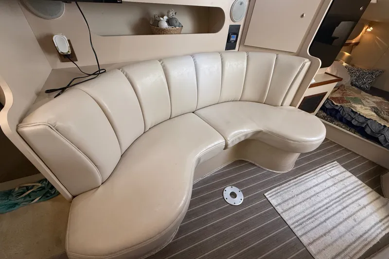 Slide: The Image of 1999 Cruisers Yachts 3075 Rogue interior with curved leather seating and striped flooring. - 33