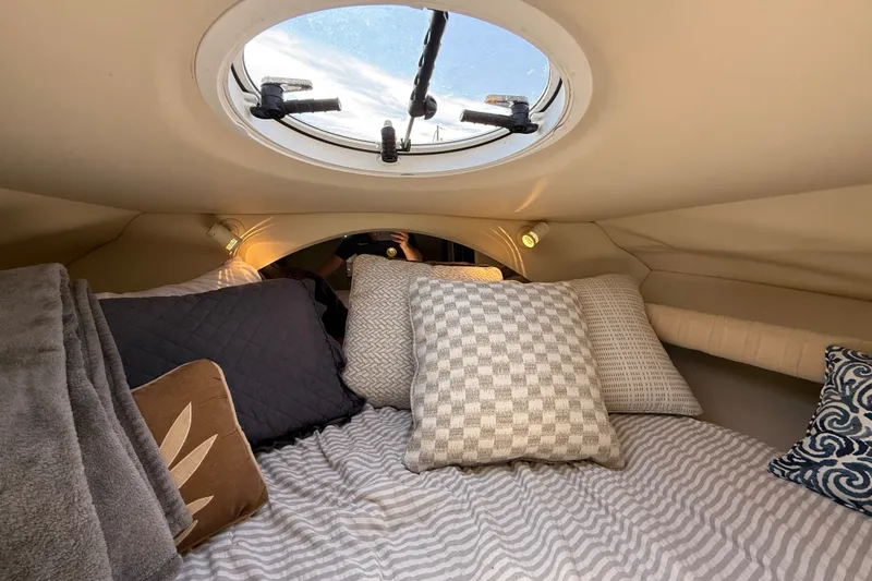 Slide: The Image of Cozy cabin interior of 1999 Cruisers Yachts 3075 Rogue with pillows and skylight. - 43