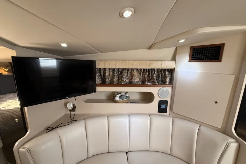 Slide: The Image of Interior of 1999 Cruisers Yachts 3075 Rogue with TV, seating, and decor. - 34