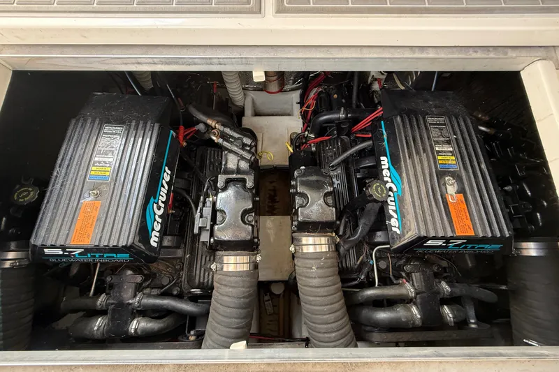 Slide: The Image of Twin MerCruiser engines in a 1999 Cruisers Yachts 3075 Rogue boat. - 55