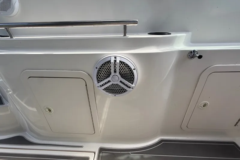 Slide: The Image of 1999 Cruisers Yachts 3075 Rogue boat deck with speaker and storage compartments. - 14