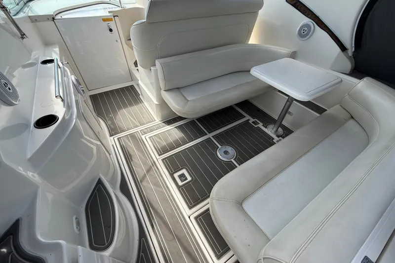 Slide: The Image of 1999 Cruisers Yachts 3075 Rogue interior with white seating and sleek flooring. - 8