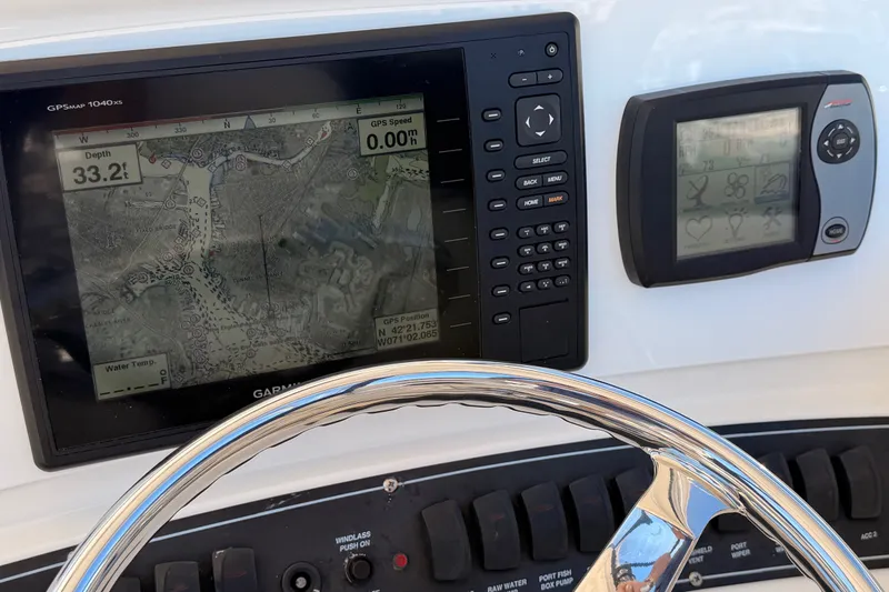 Slide: The Image of Dashboard of 2007 Boston Whaler 285 Conquest with GPS and control panel. - 26