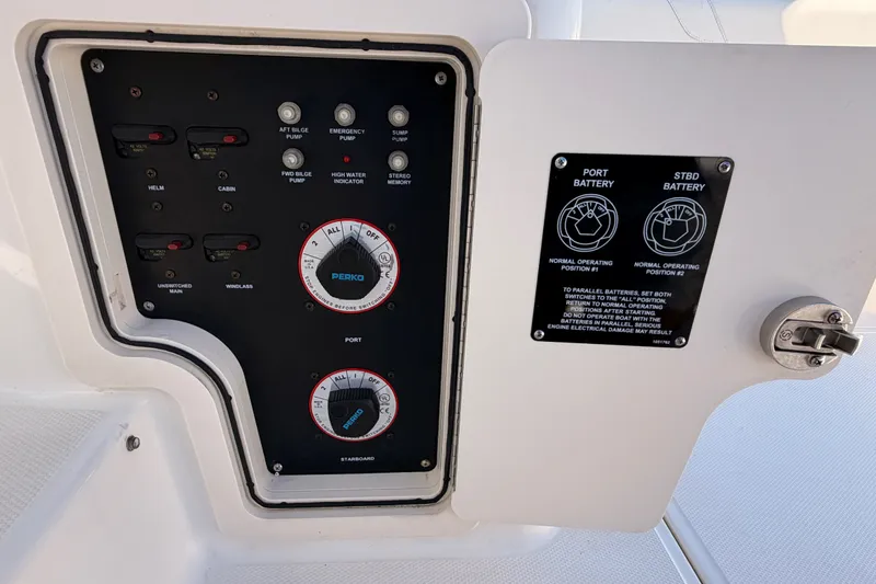 Slide: The Image of Control panel of a 2007 Boston Whaler 285 Conquest boat, showing battery switches. - 21