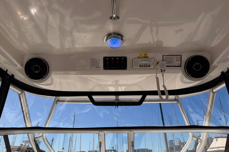Slide: The Image of Interior view of a 2007 Boston Whaler 285 Conquest boat cockpit with controls. - 29