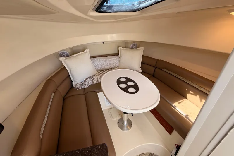 Slide: The Image of Interior of 2007 Boston Whaler 285 Conquest with cozy seating and table. - 35