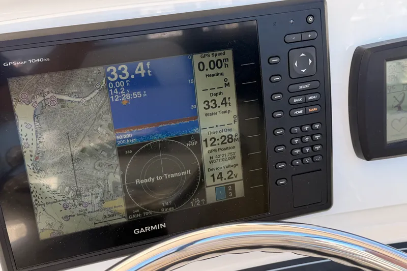 Slide: The Image of Garmin GPS display on 2007 Boston Whaler 285 Conquest boat dashboard. - 27
