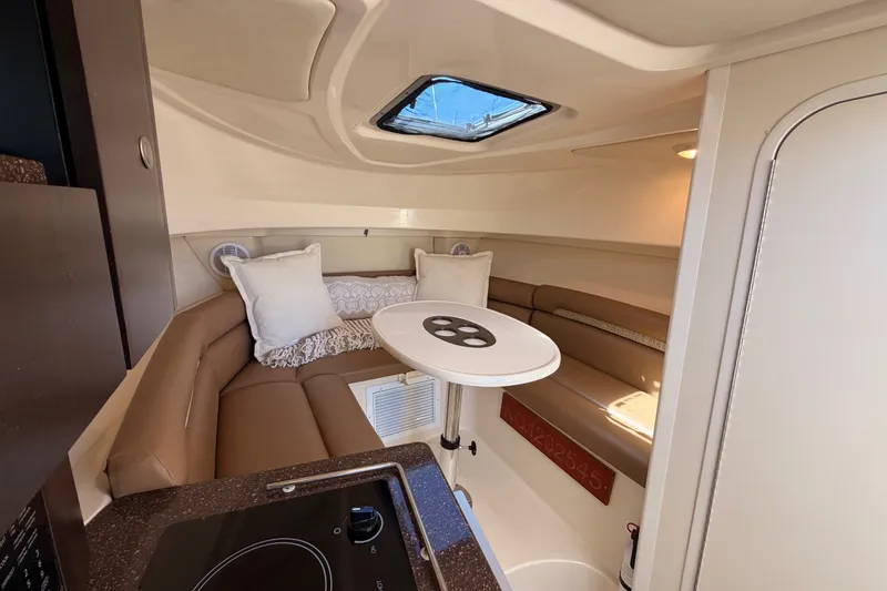 Slide: The Image of Interior cabin of 2007 Boston Whaler 285 Conquest with seating and table. - 34