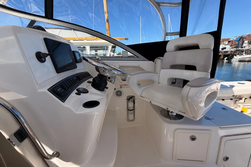 Slide: The Image of 2007 Boston Whaler 285 Conquest helm with steering wheel and navigation equipment. - 22