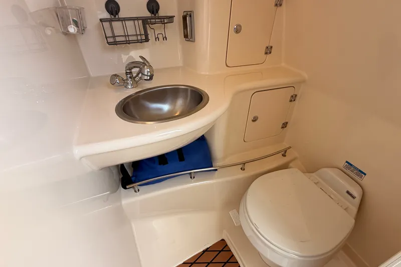 Slide: The Image of 2007 Boston Whaler 285 Conquest boat bathroom with sink and toilet. - 43