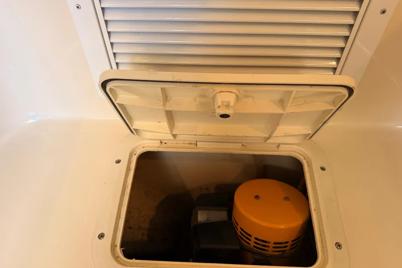 Slide: The Image of Open hatch on 2007 Boston Whaler 285 Conquest, revealing engine compartment. - 39