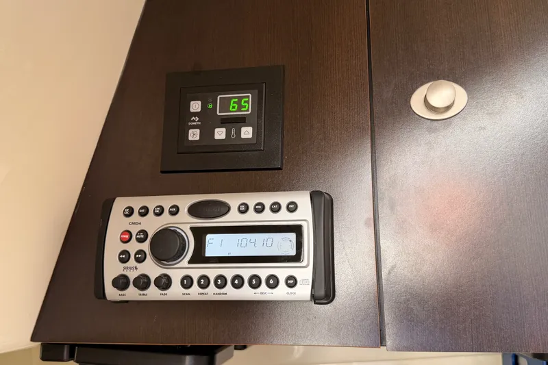 Slide: The Image of Control panel and radio on 2007 Boston Whaler 285 Conquest boat interior. - 45