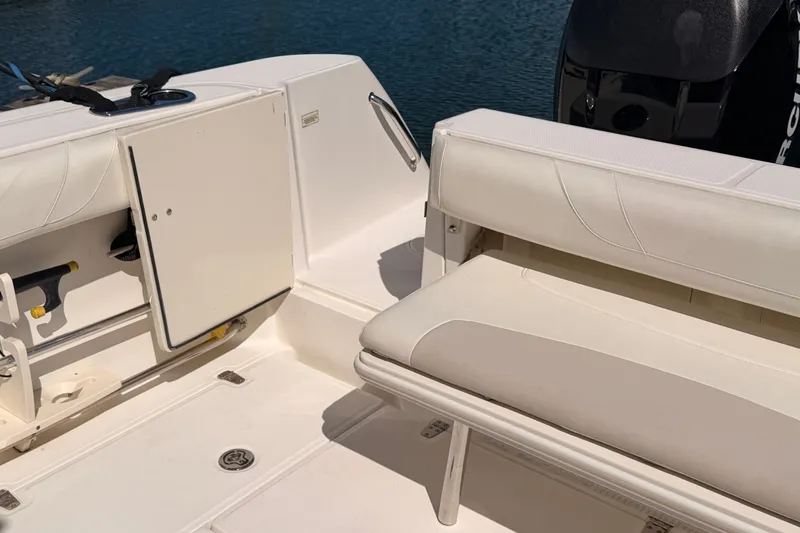 Slide: The Image of 2007 Boston Whaler 285 Conquest boat interior with seating and storage compartments. - 13