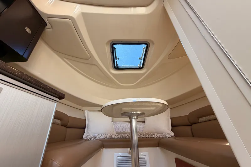 Slide: The Image of Interior cabin of 2007 Boston Whaler 285 Conquest with seating and table. - 37
