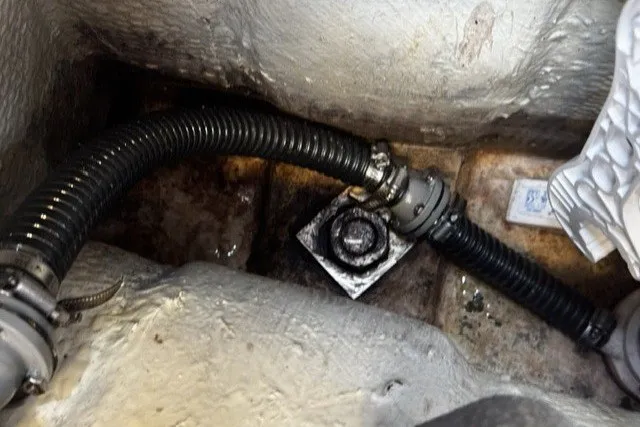 Slide: The Image of Bilge area of a 1973 C&C 46 sailboat with hoses and fittings. - 48