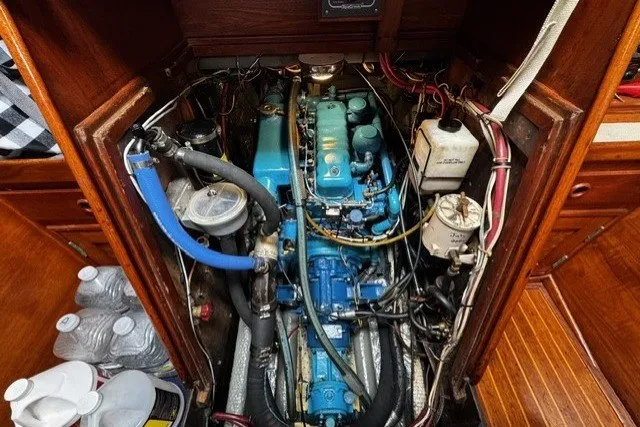 Slide: The Image of Engine compartment of a 1973 C&C 46 sailboat, showcasing detailed mechanical components. - 46