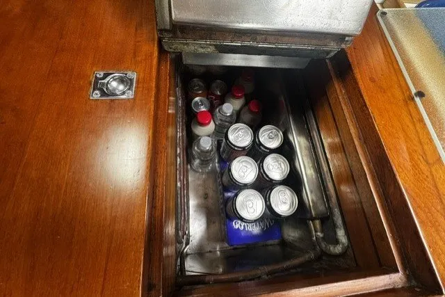 Slide: The Image of Hidden compartment in 1973 C&C 48 yacht with drinks and storage. - 23