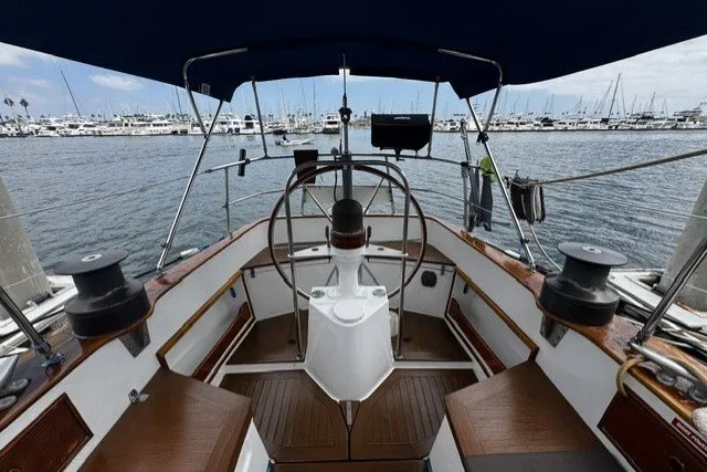 Slide: The Image of Cockpit of a 1973 C&C 48 sailboat with marina view. - 27