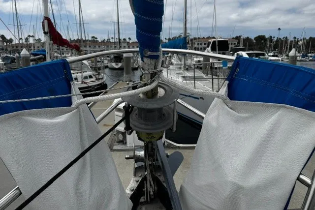 Slide: The Image of Bow view of a 1973 C&C 48 sailboat docked in a marina. - 39