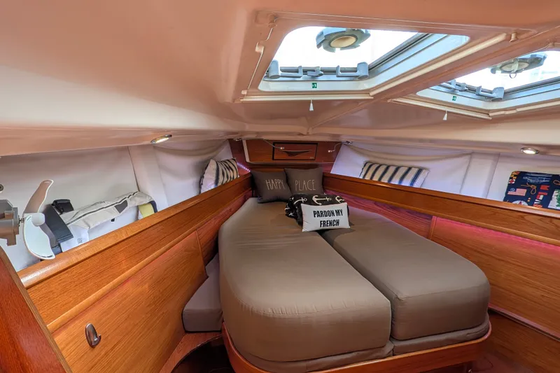 Slide: The Image of Cozy cabin interior of 2006 Jeanneau Sun Odyssey 45 sailboat with skylights and cushions. - 42