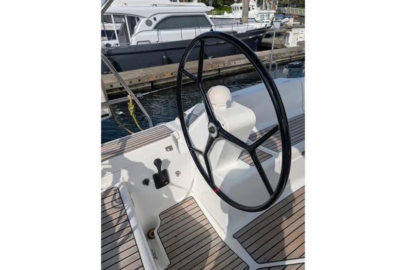 Slide: The Image of Steering wheel of a 2006 Jeanneau Sun Odyssey 45 sailboat at a marina. - 7