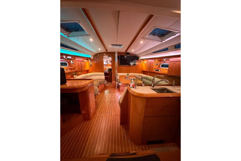 Slide: The Image of Luxurious interior of 2006 Jeanneau Sun Odyssey 45 yacht with elegant wood finish. - 28