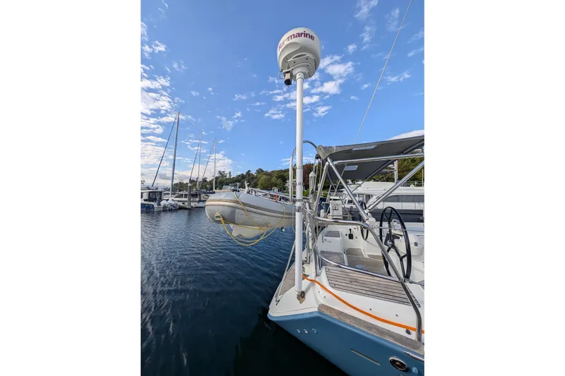 Slide: The Image of 2006 Jeanneau Sun Odyssey 45 sailboat docked with clear sky and water view. - 21