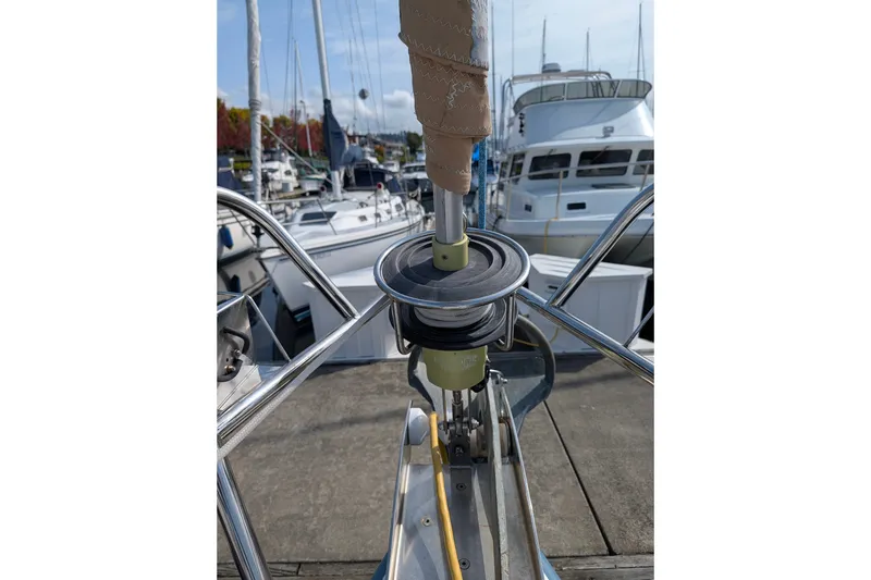 Slide: The Image of 2006 Jeanneau Sun Odyssey 45 sailboat docked at marina, featuring deck equipment. - 16