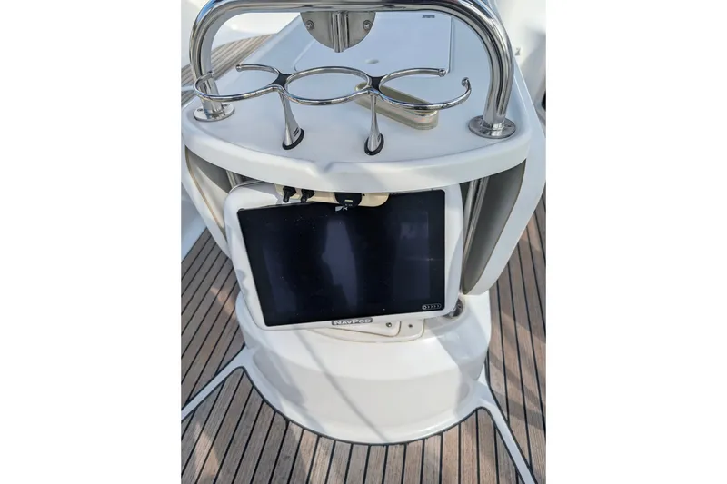 Slide: The Image of Steering console of 2006 Jeanneau Sun Odyssey 45 sailboat with navigation equipment. - 9