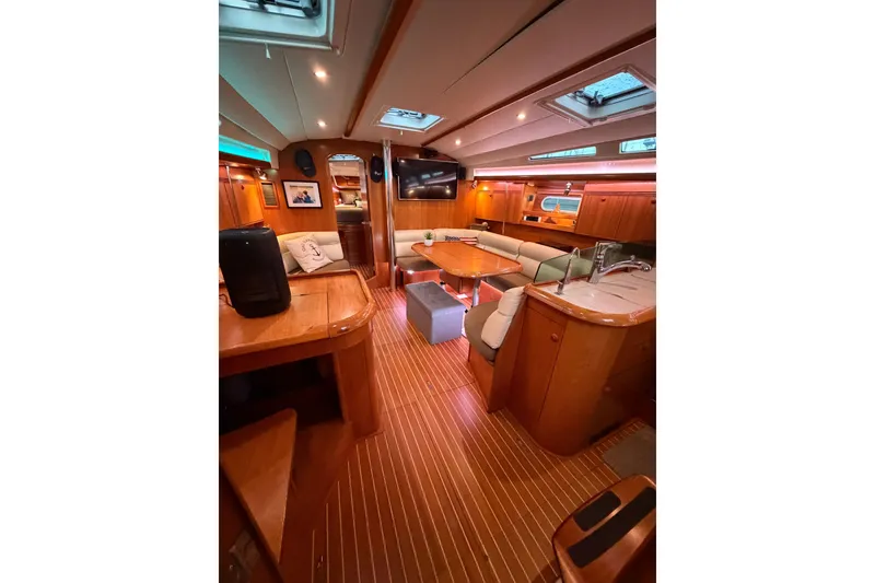 Slide: The Image of Luxurious interior of 2006 Jeanneau Sun Odyssey 45 yacht with elegant wood finish. - 27