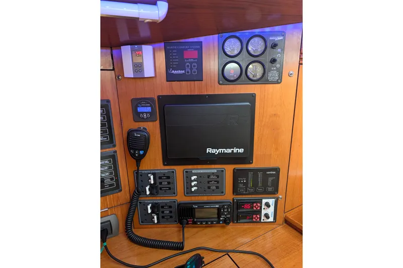 Slide: The Image of Control panel of a 2006 Jeanneau Sun Odyssey 45 sailboat with Raymarine equipment. - 33