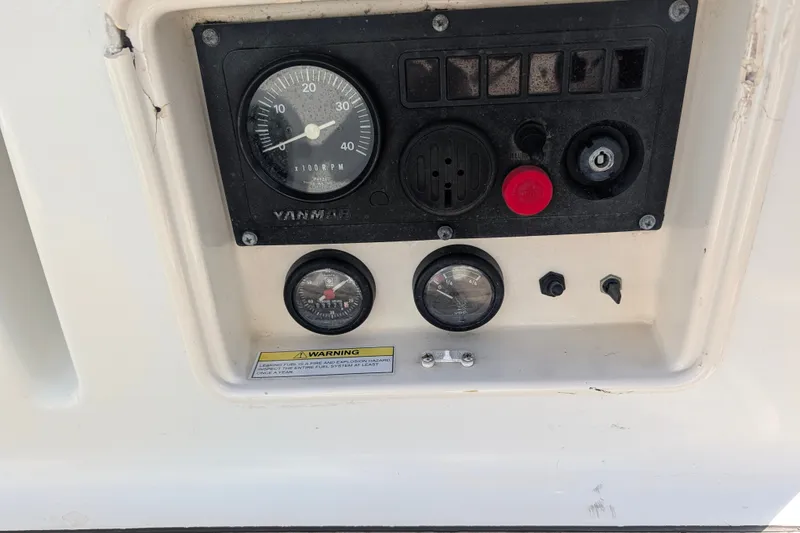 Slide: The Image of Control panel of a 2006 Jeanneau Sun Odyssey 45 sailboat with gauges and switches. - 45