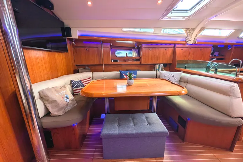 Slide: The Image of Luxurious interior of 2006 Jeanneau Sun Odyssey 45 sailboat with cozy seating and elegant wood finish. - 25