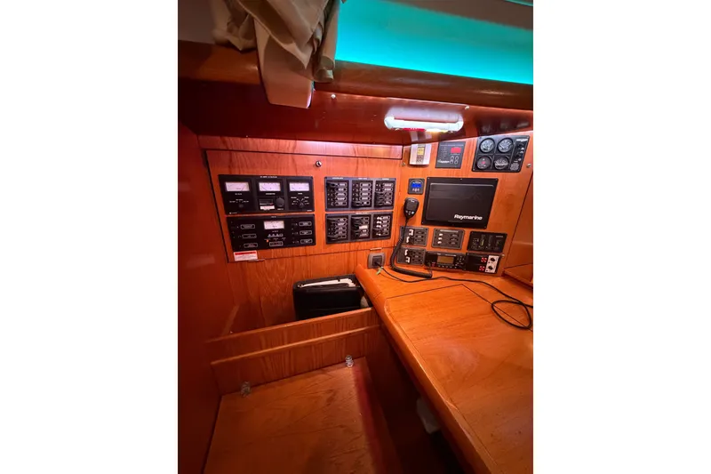 Slide: The Image of Control panel of a 2006 Jeanneau Sun Odyssey 45 sailboat, featuring navigation and communication equipment. - 30