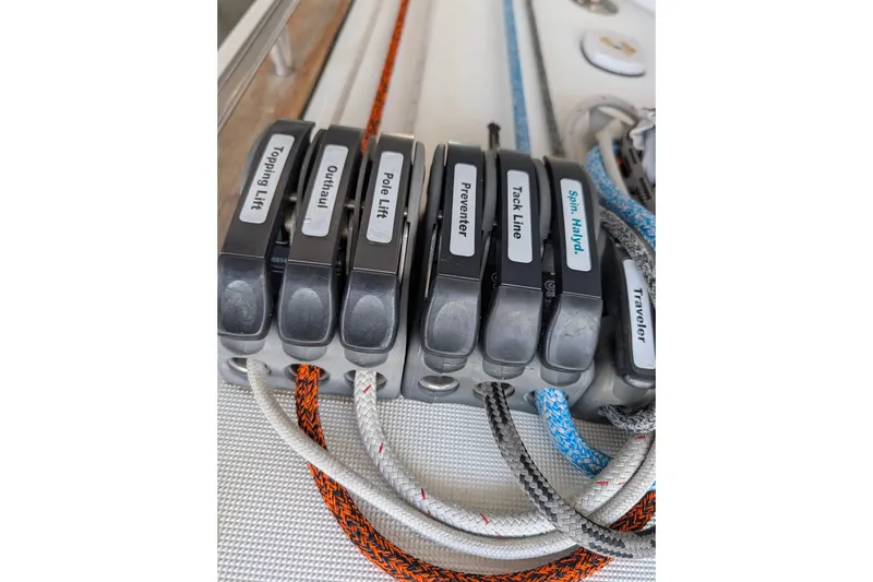 Slide: The Image of Close-up of labeled rope clutches on a 2006 Jeanneau Sun Odyssey 45 sailboat. - 19