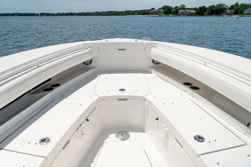 Slide: The Image of 2021 Regulator 28 Forward Seating boat interior with spacious deck and seating area. - 20