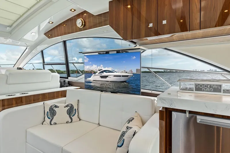 Slide: The Image of Luxurious interior of 2022 Cruisers Yachts 54 Cantius with scenic water view. - 45