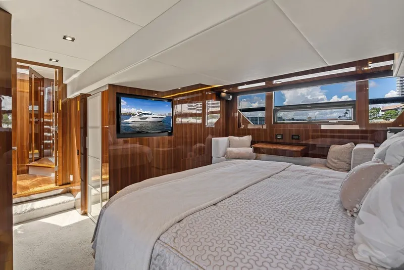 Slide: The Image of Luxurious bedroom interior of 2022 Cruisers Yachts 54 Cantius with elegant wood finishes. - 60