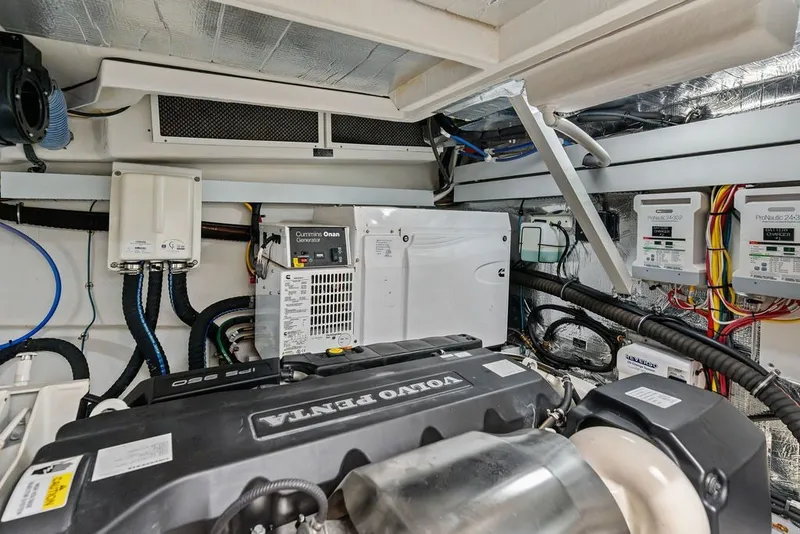 Slide: The Image of Engine room of 2022 Cruisers Yachts 54 Cantius with Volvo Penta engine and Cummins Onan generator. - 80