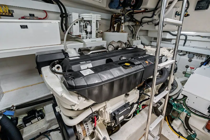 Slide: The Image of Engine room of 2022 Cruisers Yachts 54 Cantius, showcasing advanced marine machinery. - 77