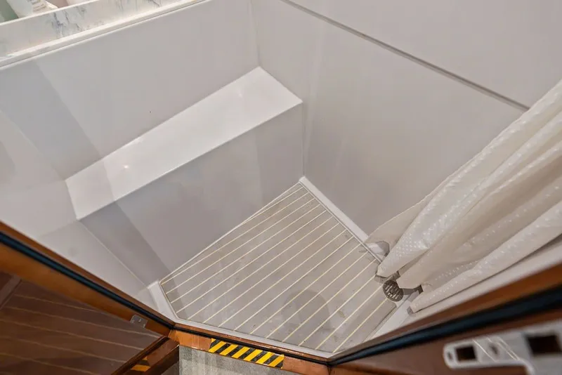 Slide: The Image of Shower area in 2022 Cruisers Yachts 54 Cantius, featuring sleek design and modern fixtures. - 71