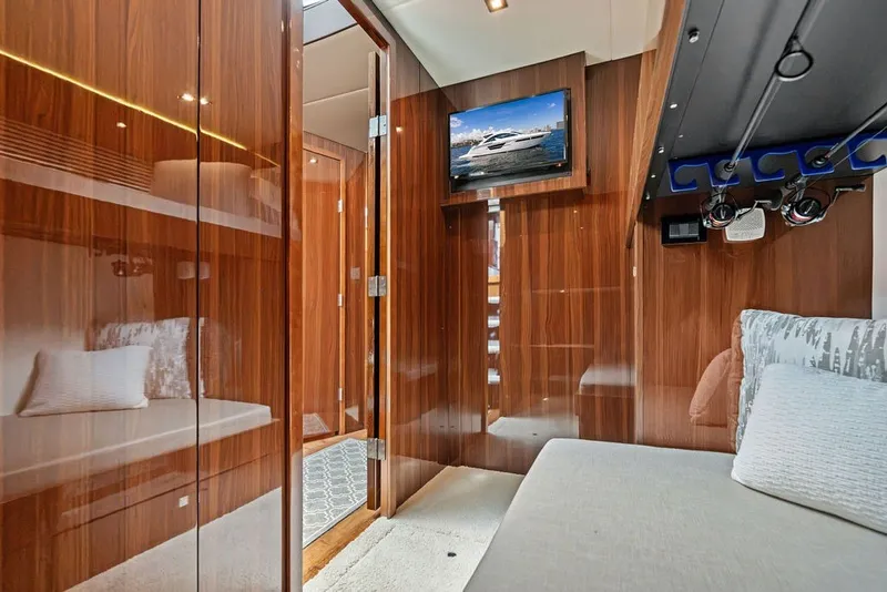 Slide: The Image of Luxurious interior of 2022 Cruisers Yachts 54 Cantius with wood paneling and modern amenities. - 70