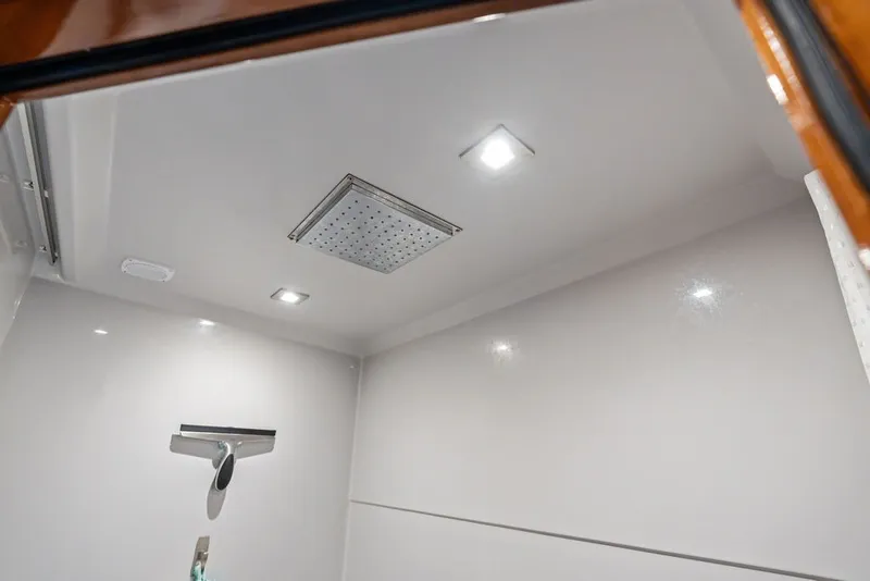 Slide: The Image of 2022 Cruisers Yachts 54 Cantius shower with modern fixtures and recessed lighting. - 72