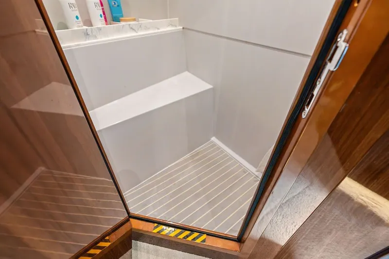 Slide: The Image of Shower area inside 2022 Cruisers Yachts 54 Cantius, featuring sleek design and modern amenities. - 73