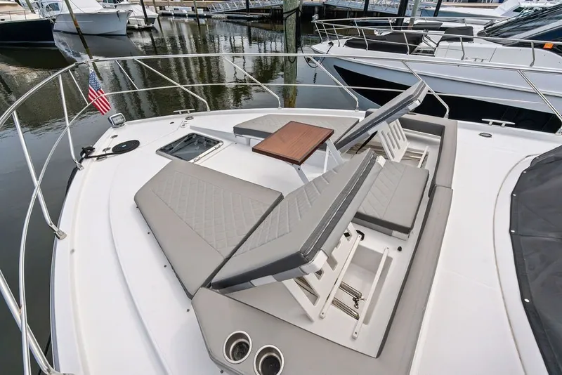 Slide: The Image of 2022 Cruisers Yachts 54 Cantius deck with adjustable seating and table. - 24